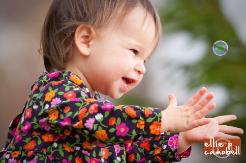 Lily playing with bubbles