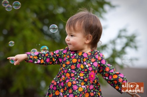Lily playing with bubbles